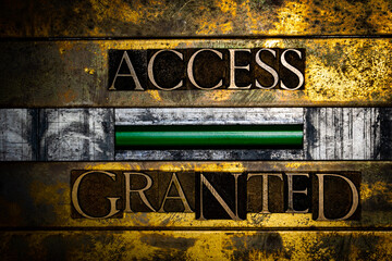 Acces Granted text message with green confirmation sign on vintage textured grunge copper and gold background