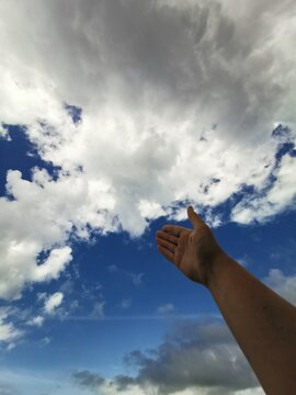 hand and sky