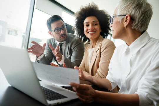 Portrait of business people, architects having discussion in office