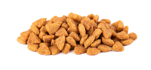 Dry pet food, isolated on white background. Pile of granulated animal feeds. Granules of good nutrition for dogs and cats.