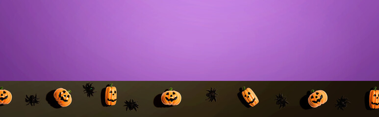 Miniature Halloween pumpkin ghosts with spiders - flat lay