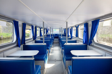 Naklejka na ściany i meble Generic passenger ship interior with tables and seats
