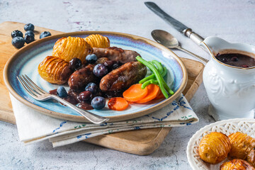Venison sausages with blueberry gravy