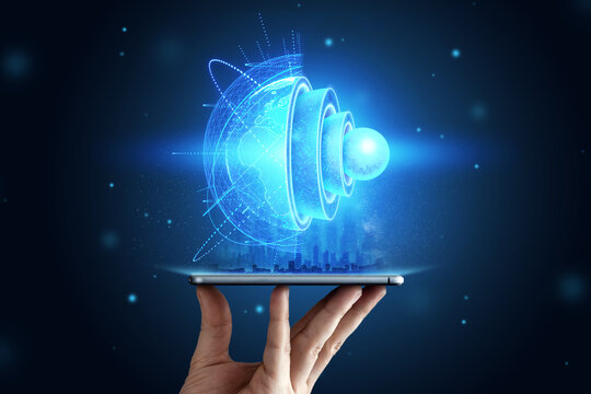 blue hologram Internal structure of the earth above the tablet, the structure of the core, geological layers. Earth geology concept, new technologies