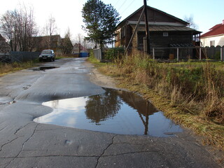 asphalt and puddles in the village