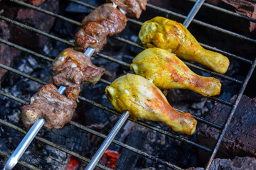 yellow marinated grilled chicken legs and outdoor bbq