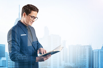 Young handsome businessman in suit and glasses thinking how to tackle the problem, new career opportunities, MBA assignment. Kuala Lumpur on background. Double exposure.