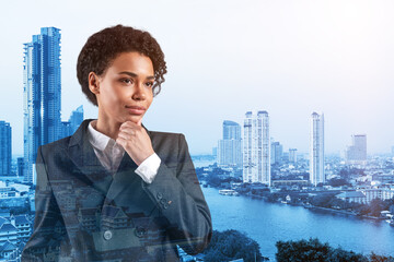 Attractive black African American business woman in suit with hand on chin thinking how to succeed, new career opportunities, MBA. Bangkok on background. Double exposure.