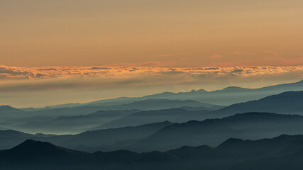 Fototapeta premium Clouds covering part of the mountain peaks of the Apennine peninsula.