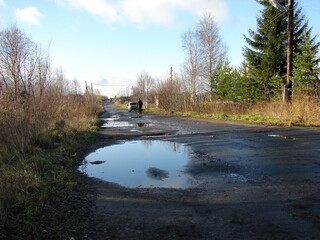 asphalt and puddles in the village
