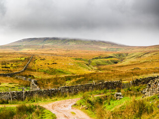 Naklejka premium The wild moorland with dry stone walls of the Yorkshire moors. Scar House. Nidderdale. Yorkshire Dales