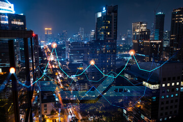 Stock market graph hologram, night panorama city view of Bangkok, popular location to gain financial education in Asia. The concept of international research. Double exposure.