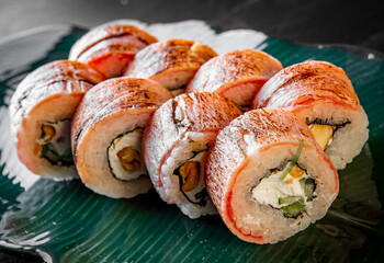 sushi roll with fish and rice in plate