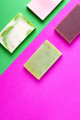 Handmade soap against the colorful geometric background. Natural body wash