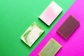 Handmade soap against the colorful geometric background. Natural body wash