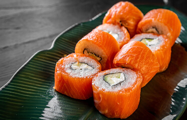 sushi roll with fish and rice in plate