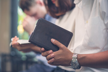 Christians and Bible study concept. Group of discipleship Studying the Word Of God in church and...
