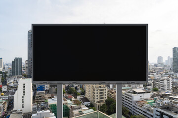 Blank black road billboard with Bangkok cityscape background at day time. Street advertising poster, mock up, 3D rendering. Front view. The concept of marketing communication to promote or sell idea.