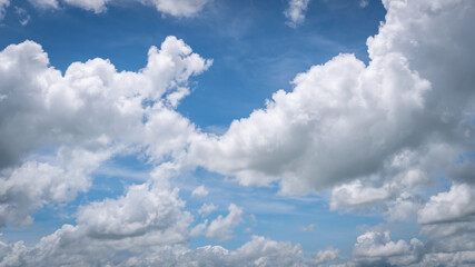The blue sky with moving white clouds. The most of clouds are beautiful color and shade, suitable for use as background image.