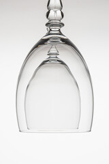 High key studio image of a wine glass with a white background. The silhouette of the glass is...