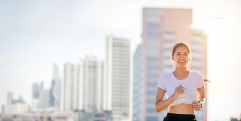 smiling Asian Young fitness sport woman running  and Sportive people training in a urban area, healthy lifestyle and sport concepts. © tuiphotoengineer