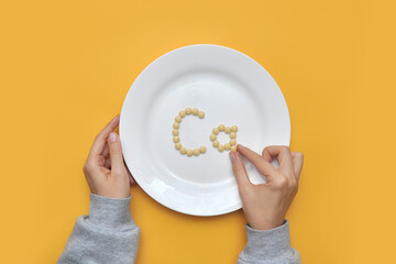 Sign of the trace element "calcium" from tablets on a white plate. calcium deficiency in the body