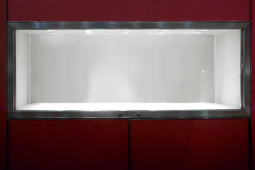 empty window display showcase glass on red wall