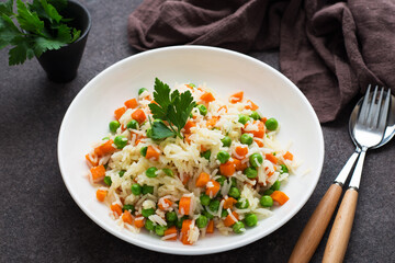 Boiled rice with vegetables, traditional Oriental dish
