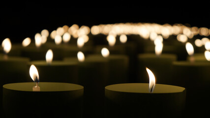 blurred background,Many burning candles have a shallow depth of field.