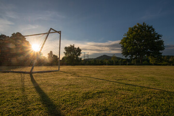 soccer goal with sun beam in the morning light