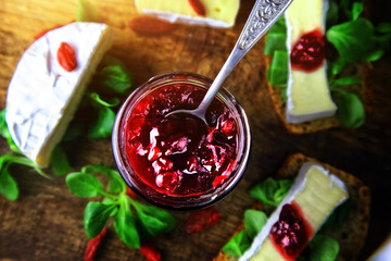 delicious sandwiches with preserves and camembert cheese