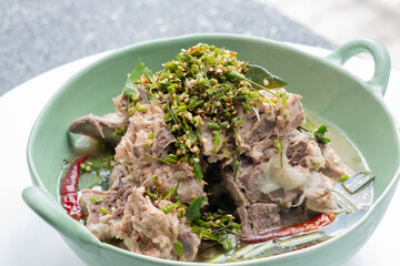 Close up Hot and Spicy Soup with Pork Ribs. Spicy Pork with Pork bone Soup (Lang Zaap). (Selective Focus)