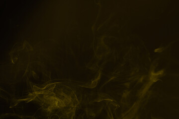 Yellow steam on a black background.