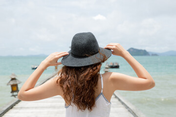 Back side of woman walking on the bridge