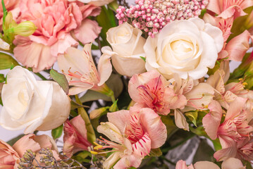 Bouquet of  soft pink flowers in wrapping paper.