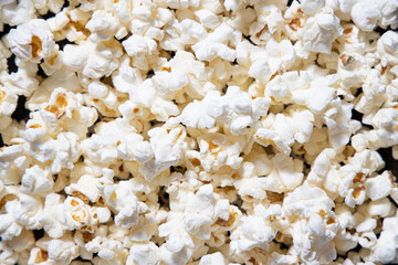 Scattered salted popcorn, texture background