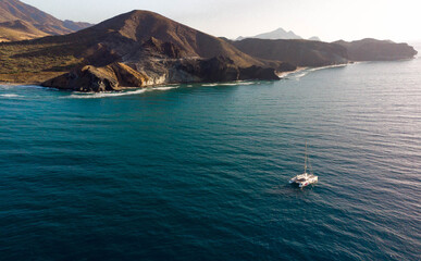 boat in the middle of the sea with beautiful beaches