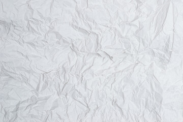 Crumpled white paper background.