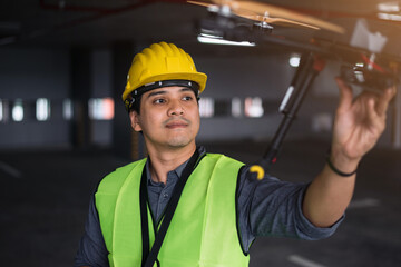 Contruction worker with drone on building site. Drone operated by construction worker