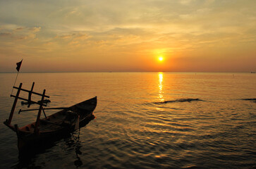 Fishing boat at sunset off the coast in Cambodia