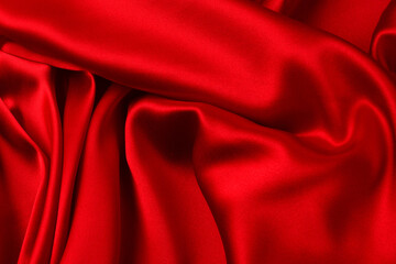 Red silk or satin luxury fabric texture can use as abstract background. Top view