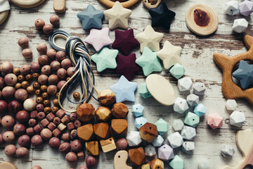 Wooden organic baby teether toy details. Flat lay set for making children's wooden toys, food grade...