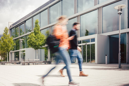 Blurred Silhouette Of Students Being Busy On University Campus