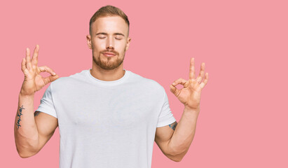 Young irish man wearing casual clothes relax and smiling with eyes closed doing meditation gesture...
