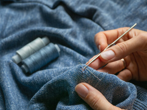 A hole in the clothing. Restoration of a knitted sweater.