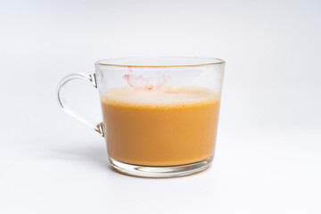 Milk tea or popularly known as The Tarik in Malaysia, with a red lip stamped on it isolated on the white background center of the frame