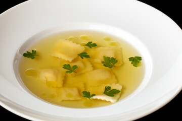 Chicken soup with cheese ravioli.