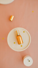 Gold perfume bottle laying on the  round stand top view flat lay
