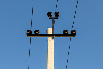 High voltage power line. Electric power line support and wires. blue sky.
