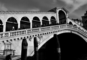 Fototapeta na wymiar Venice, Italy, December 28, 2018 evocative black and white image of the Rialto Bridge, one of the best known symbols of the city